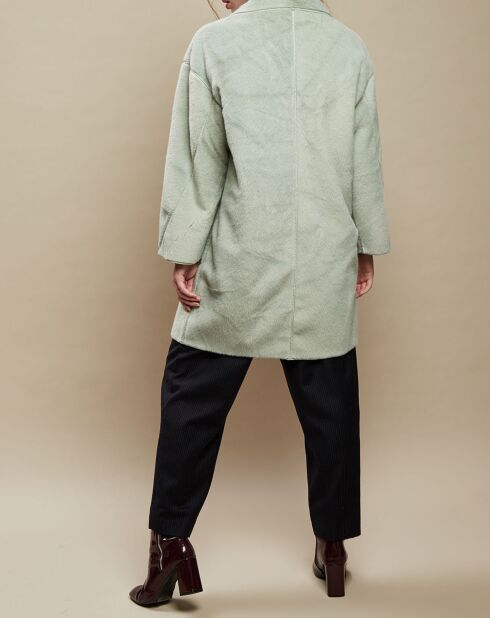 Groene jas met knopen van imitatiebont
