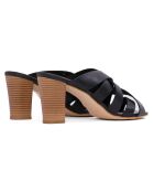 Mules Aryana de piel negra, tacón de 7,5 cm