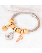 Brazalete con forma de corazón plateado, dorado y rosa