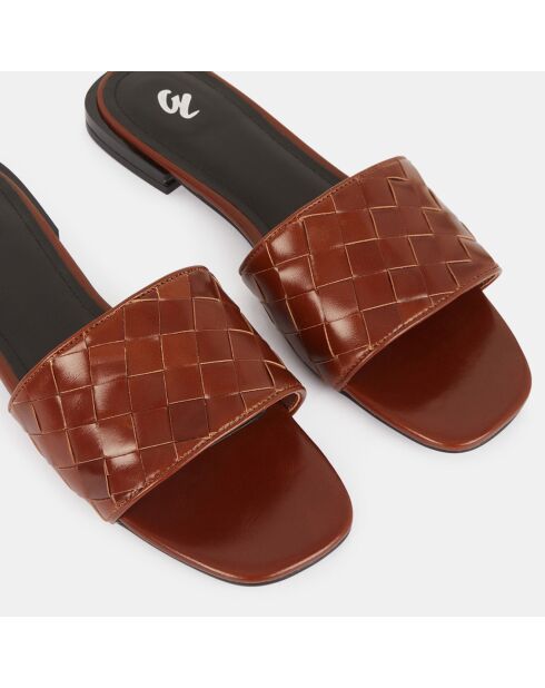 Platte leren muiltjes met bruine gevlochten band