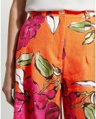 Orangefarbene Hose aus Leinen und Viskose mit schillerndem Blumenmuster