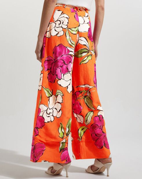 Orangefarbene Hose aus Leinen und Viskose mit schillerndem Blumenmuster