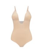 Body delgado que forma una tanga profunda de color beige