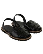 Sandalias negras de cuero universitario