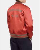 Blouson satiné avec patchs rouge