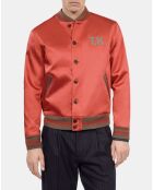 Blouson satiné avec patchs rouge