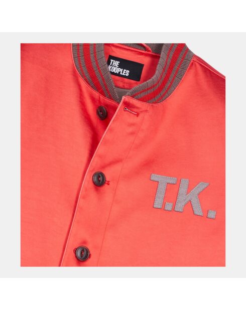 Blouson satiné avec patchs rouge