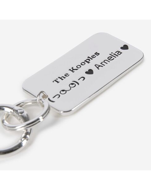 Bijou de sac plaque logo argenté