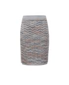 Jupe Nyméria base argentée avec espaces multi-oranges et bleus.teint