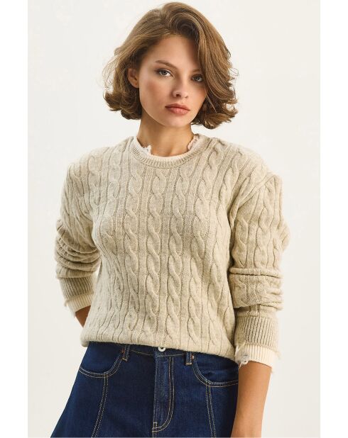 Pull en grosse maille avec poignets côtelés et découpes beige