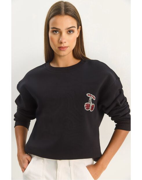 Trui met ronde hals versierd met zwarte kersenstenen