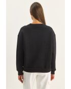 Trui met ronde hals versierd met zwarte kersenstenen