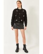 Chaleco de punto estampado con borlas negras