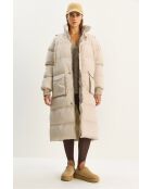 Piumino lungo con cappuccio nascosto in beige