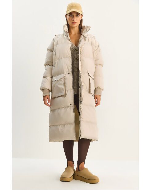 Piumino lungo con cappuccio nascosto in beige
