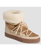 Beigefarbene Schneestiefel mit Lammfellfutter