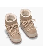 Beigefarbene Schneestiefel mit Lammfellfutter