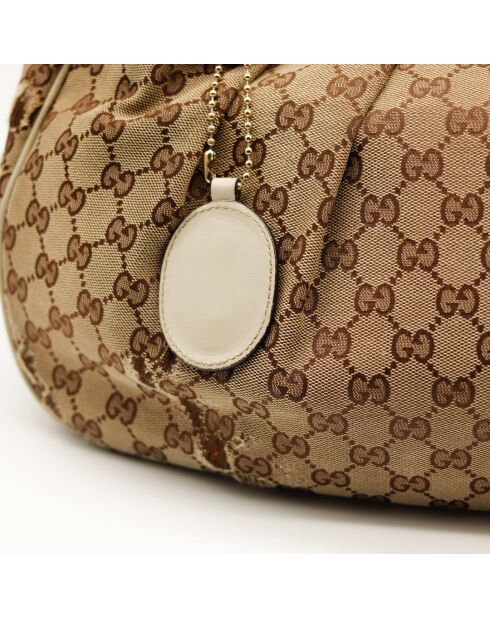 Le Sukey Gucci beige - Bon état avec griffures sur le canevas GG