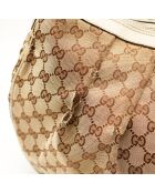 Le Sukey Gucci beige - Bon état avec griffures sur le canevas GG