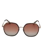Lunettes de soleil Tencia hexagonales dorées rose