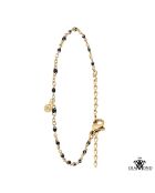 Roestvrijstalen armband versierd met een echte witte diamant en gouden zwarte harskralen