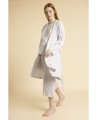 Witte zwangerschapsjurk met lange mouwen en dalmatiërpatroon