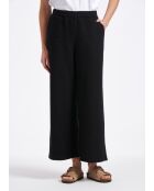 Pantalones anchos Sophia con solapa grande en jersey negro con hebilla