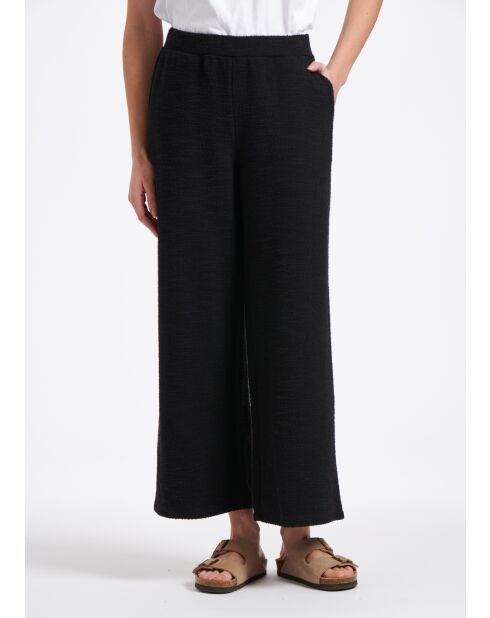 Pantalones anchos Sophia con solapa grande en jersey negro con hebilla