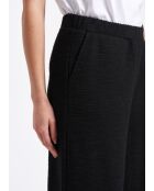 Pantalones anchos Sophia con solapa grande en jersey negro con hebilla