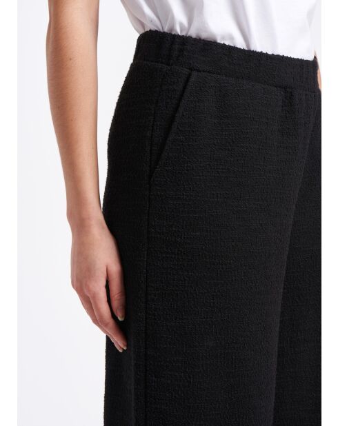 Pantalones anchos Sophia con solapa grande en jersey negro con hebilla