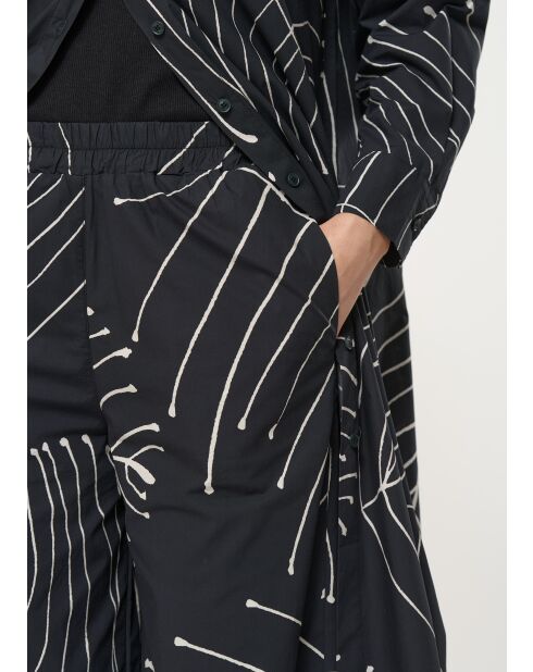 Jusanka schwarze weite Baumwollhose mit Pflanzenprint