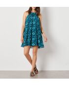 Linoh-Kleid gedruckt auf grünem Hintergrund