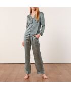 Rugbroek met groene achtergrondprint