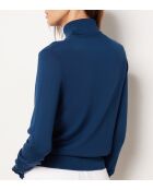 Jersey de cuello alto entrecruzado con estampado de fondo verde