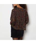 Blouse van Noellie gedrukt op een bruine achtergrond