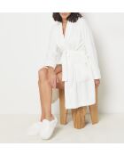 Nieuwe witte muiltjes van Harold