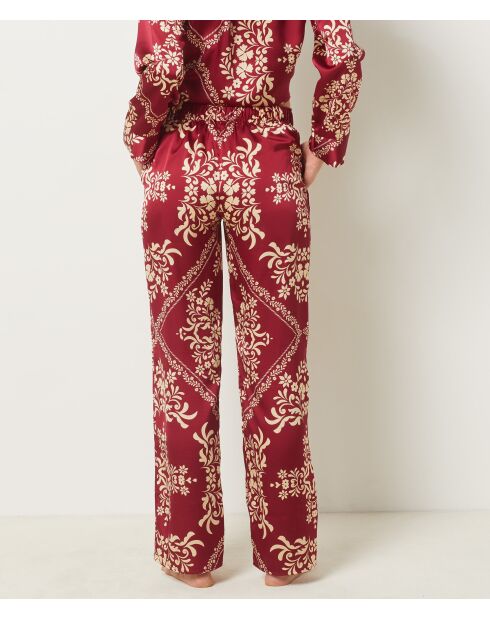 Bordeauxrode broek met granaatrode bloemen