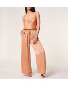 Canotta con girasole e sabbia