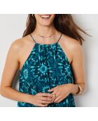 Linoh-Kleid gedruckt auf grünem Hintergrund