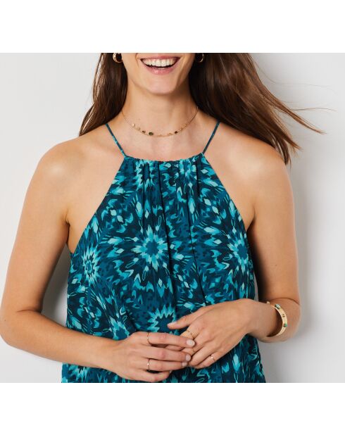 Linoh-jurk gedrukt op een groene achtergrond