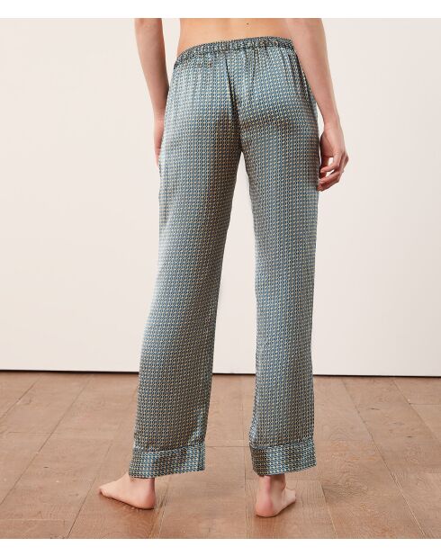 Rugbroek met groene achtergrondprint