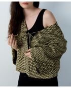 Nosi driedelige pyjama gedrukt op een zwarte achtergrond