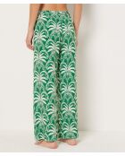 Vijay bedrukte broek op groene achtergrond