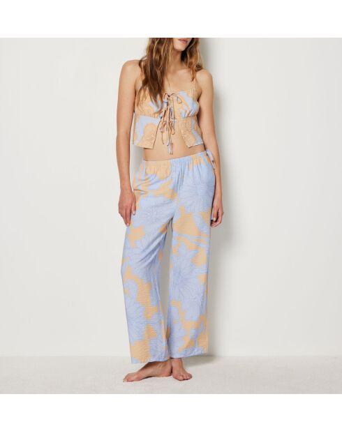 Magnoliabroek met blauwe achtergrondprint