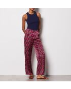 Pantalones blancos con estampado de fondo morado