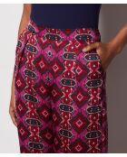 Pantalones blancos con estampado de fondo morado