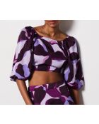 Uzes top met paarse achtergrondprint