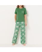 Vijay bedrukte broek op groene achtergrond