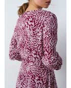 Olympia-jurk met print op de achtergrond van granaat