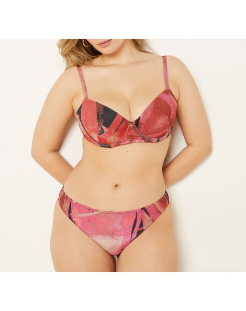 Klassischer BH mit Bügel und Flitterwochen-Muschel auf Backsteingrund